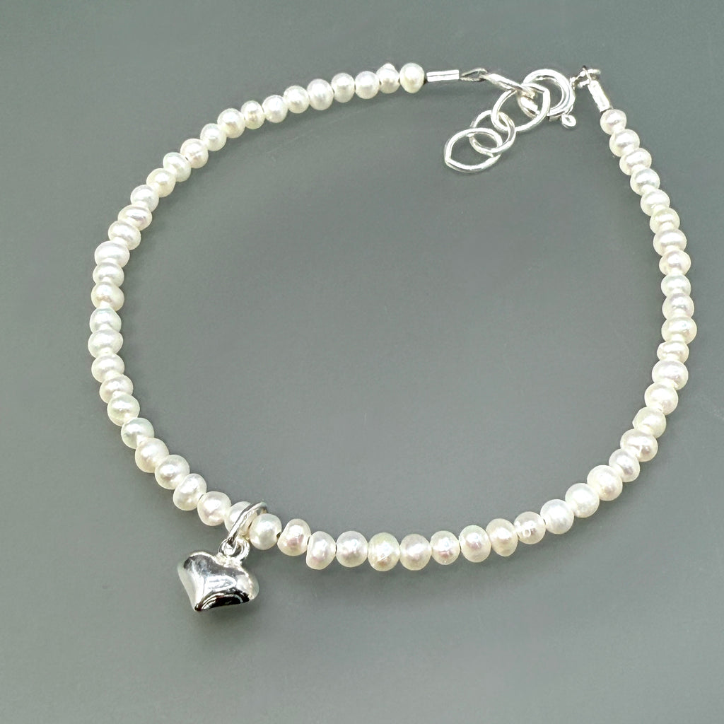 Sterling silver tiny heart on white pearls bracelet