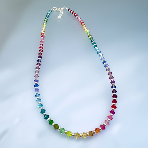 color gradient necklace made of crystals with silver between. Standard rainbow with pink tones added between the red and orange