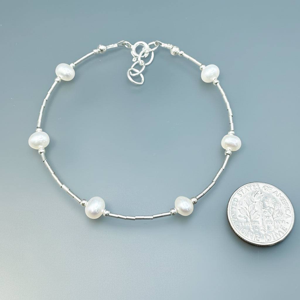 White spaced pearls bracelet on sterling silver