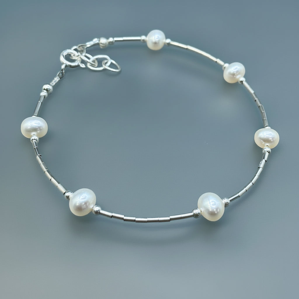 White spaced pearls bracelet on sterling silver