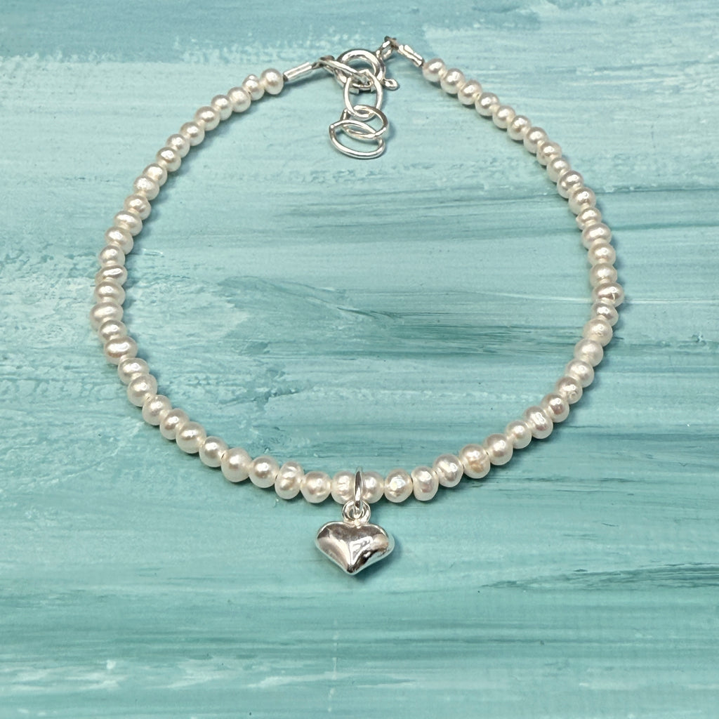 Sterling silver tiny heart on white pearls bracelet