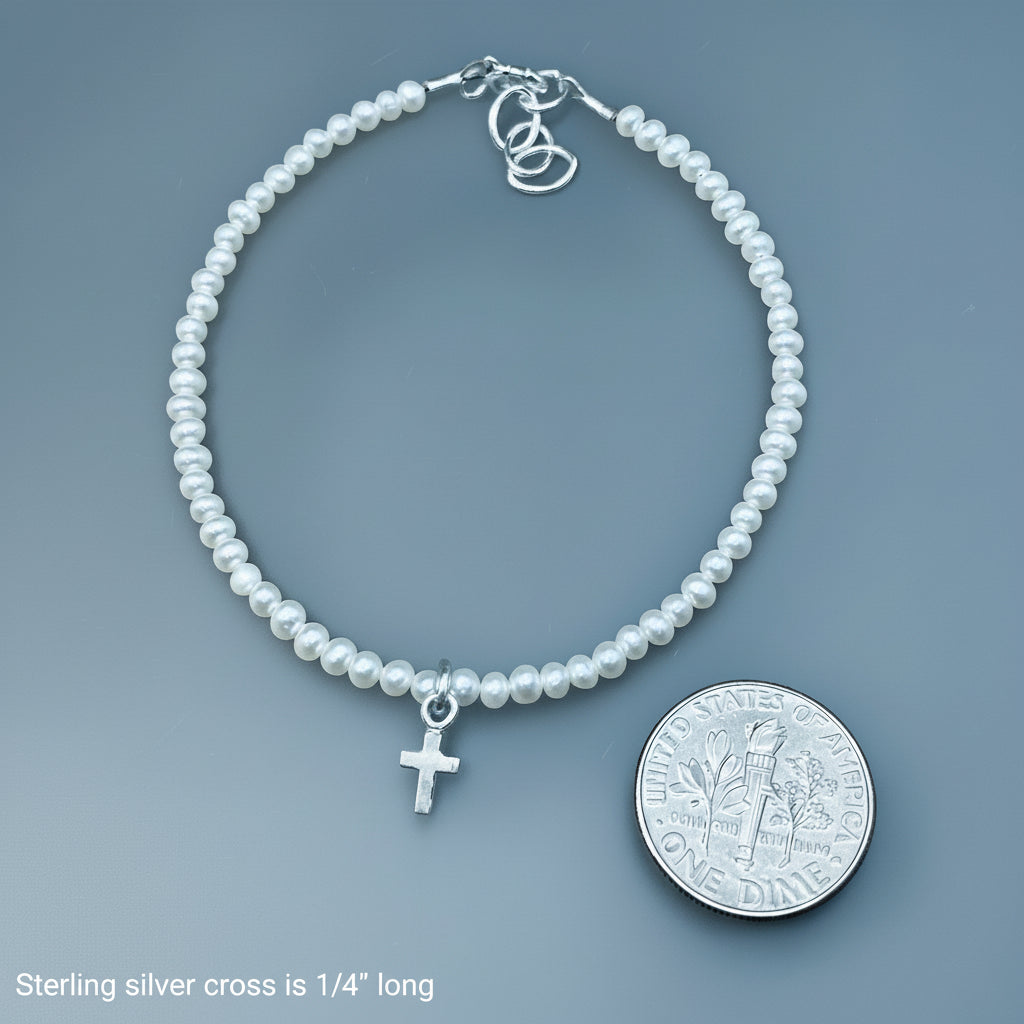 Sterling silver tiny cross on white pearls bracelet