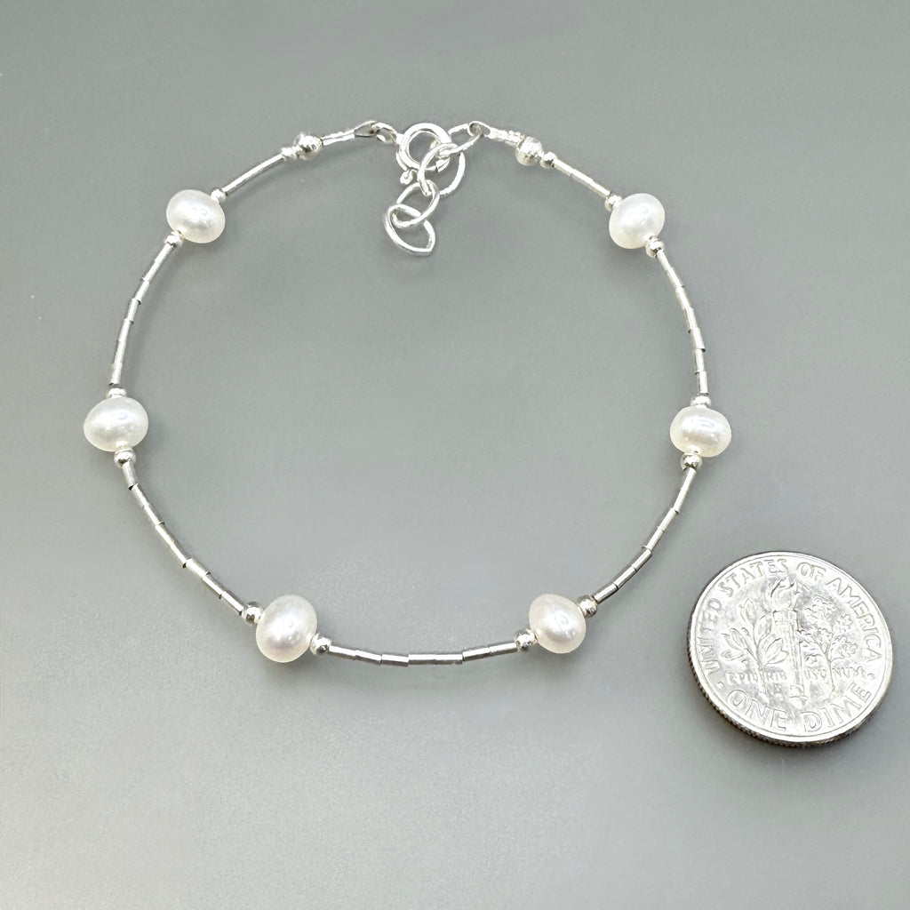 White spaced pearls bracelet on sterling silver
