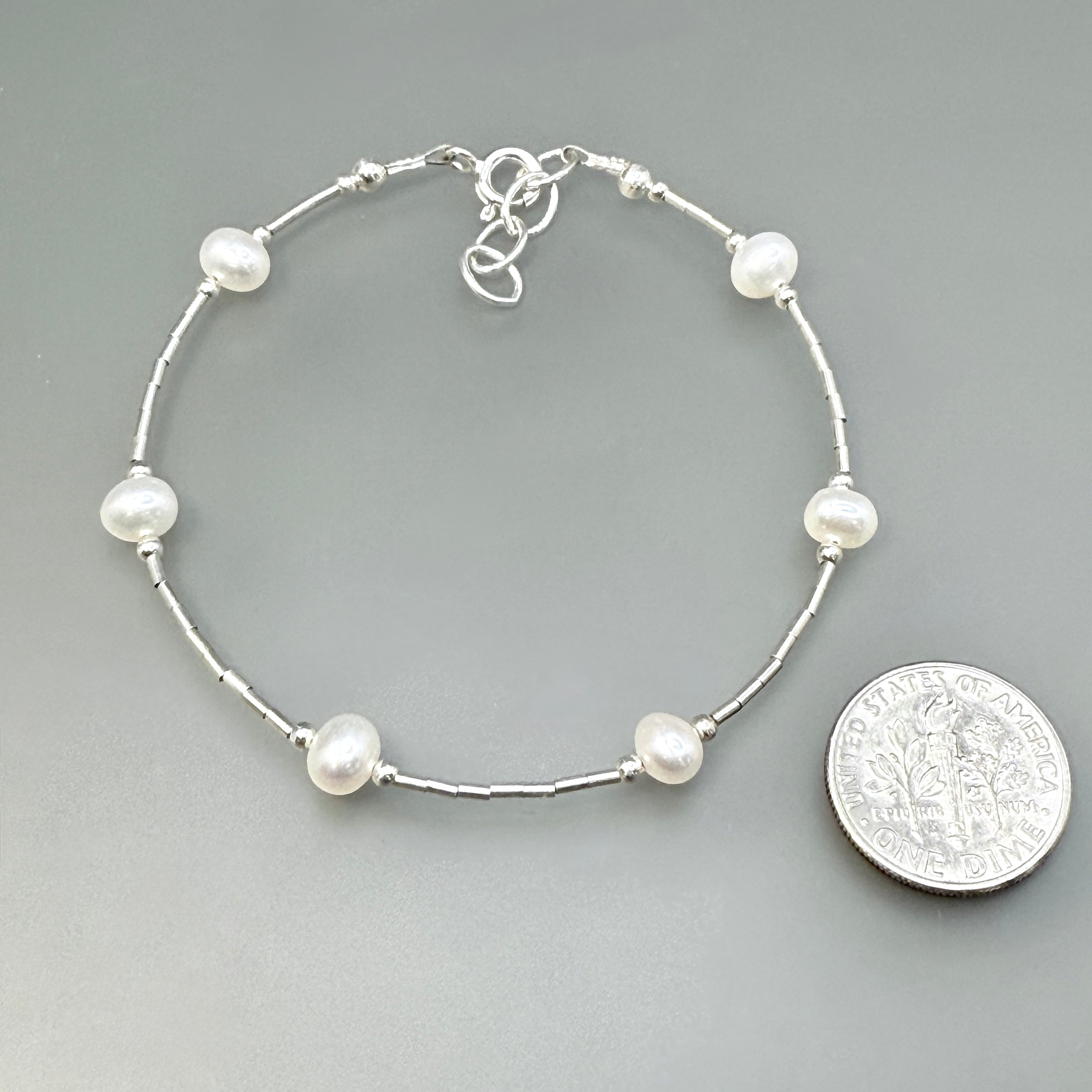 White spaced pearls bracelet on sterling silver
