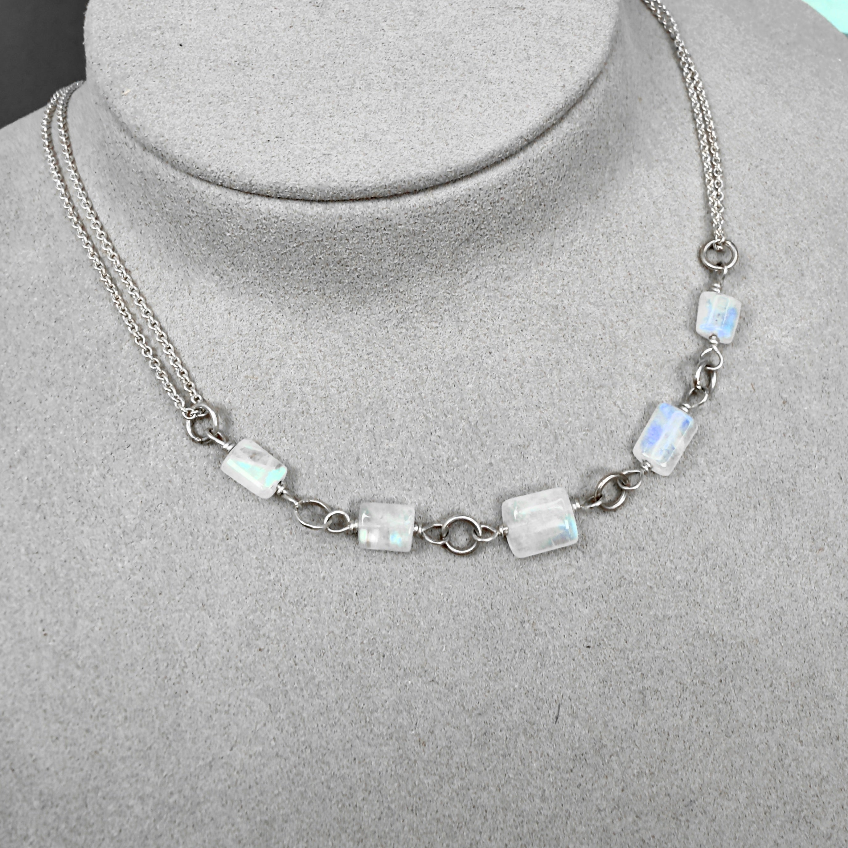 Necklace with rainbow moonstone beads on a mannequin